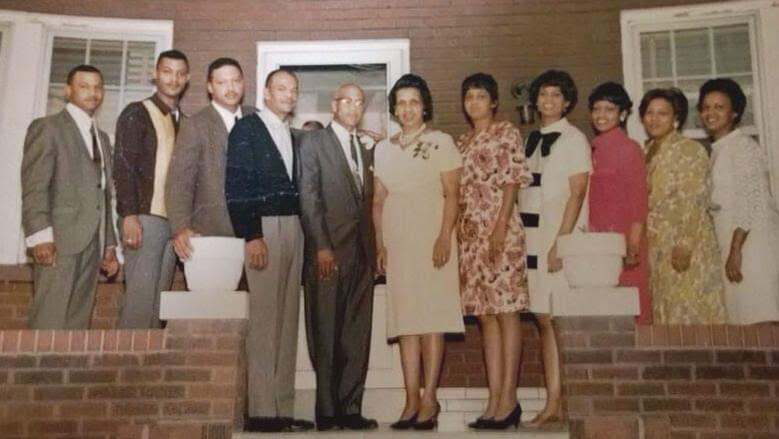 Johnson family elders gathered on the front porch steps — open the shared photo album